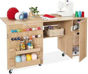 Best Choice Products Large Folding Sewing Table, Multipurpose Portable Craft Station & Side Desk w/Compact Design, Caster Wheels, Storage Shelves, 2 Storage Trays, Magnetic Doors - Light Brown