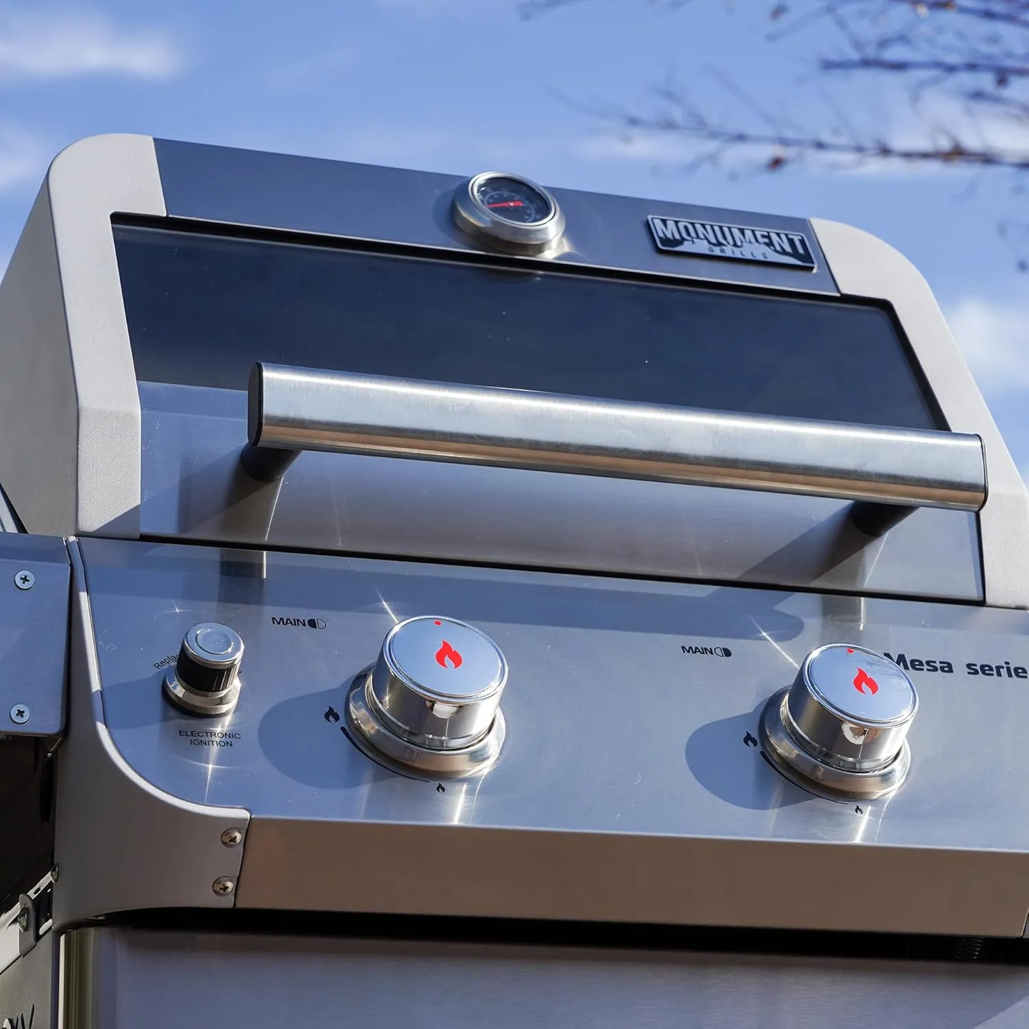 Monument Grills 2-Burner Stainless Steel Liquid Propane Gas Patio Garden Barbecue Grill with Clearview® Lid, Knob Control and Two Foldable Shelves Mesa200S